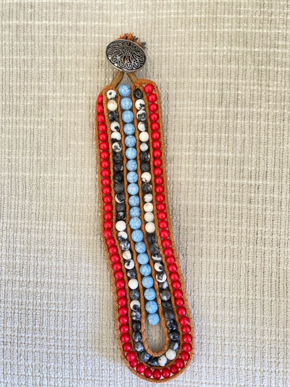 Multi-Strand Beaded Bracelet with Red, Light Blue and Cream Accents